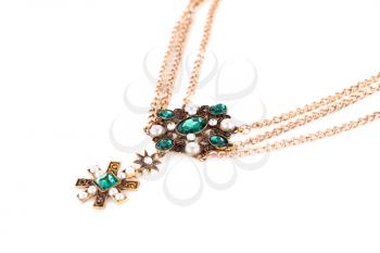 Stylish necklace with green stones and pearls isolated on white background.