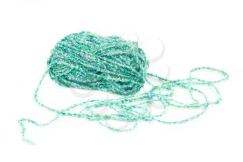 The green knitting yarn clew isolated on white background.