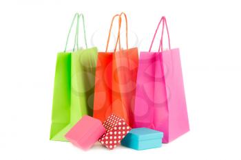 Colorful paper shopping bags and gift boxes isolated on white background.
