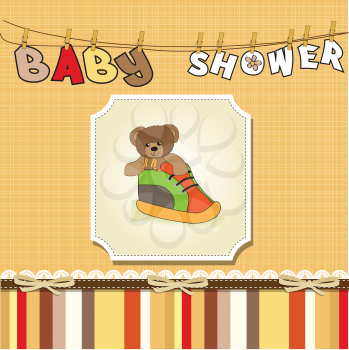 Royalty Free Clipart Image of a Teddy Bear in a Shoe on a Baby Shower Background