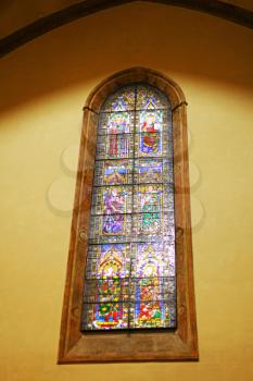 Stained-glass window in Catholic temple. Rome. Italy