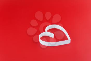 St. Valentine Day. Single  heart, on red background.