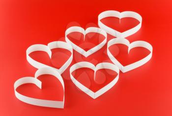 A lot of hearts (six), on red background.