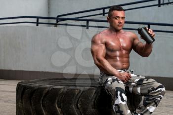 Bodybuilder with Protein Shake