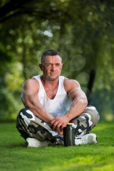 Bodybuilder Resting In Nature