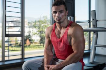 Young Muscular Caucasian Man Resting At The Bench
