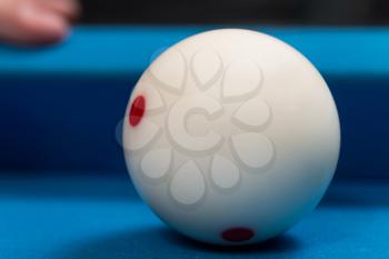Close-Up Of A White Ball Waiting To Shoot