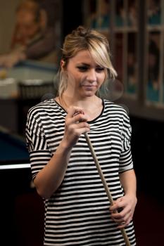 Close-Up Of A Young Female Model Playing Billiards