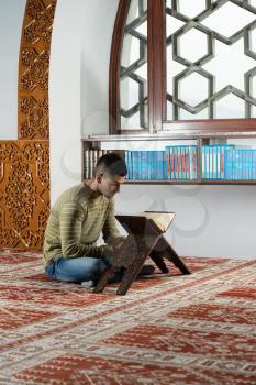 Muslim Man Is Reading The Koran