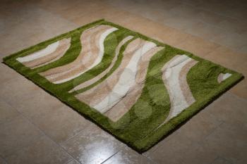 Single Green Carpet Folded On Floor