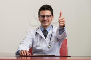 Happy Smiling Cheerful Doctor With Thumbs Up Gesture