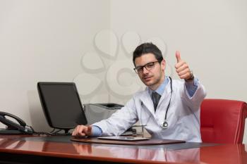 Happy Smiling Cheerful Doctor With Thumbs Up Gesture