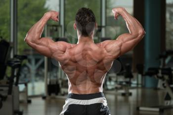 Body Builder Performing Rear Double Biceps Pose
