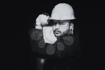 Portrait Of Business Man With Helmet On Construction