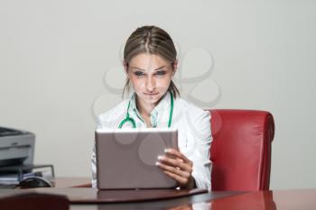 Young Pretty Female Doctor With Digital Tablet In The Office - Successful Woman Doc At Work