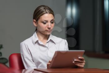 Young Businesswoman In Formalwear Working On Digital Tablet And While Working In The Office - Successful Business Woman At Work