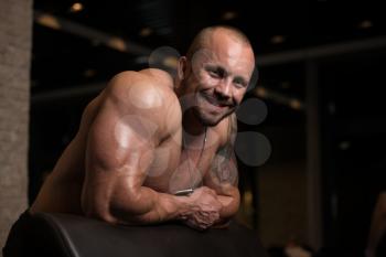 Healthy Bodybuilder Resting In Healthy Club After Exercising
