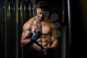 Muscled Boxer Wearing Blue Strap On Wrist