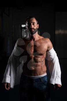 Portrait Of A Sexy Muscular Man In Pants And Shirt Posing