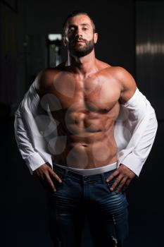 Portrait Of A Sexy Muscular Man In Pants And Shirt Posing