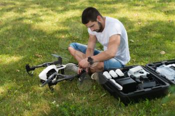 Closeup of Young Engineer Tightening Propeller of Uav Drone With Hand Tool in Park