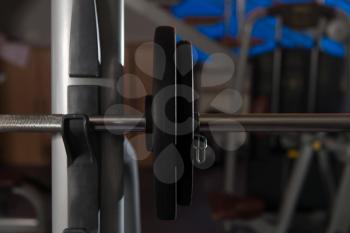 Barbell and Weights at the Modern Gym Room Fitness Center