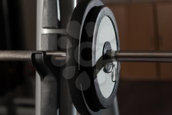 Barbell and Weights at the Modern Gym Room Fitness Center