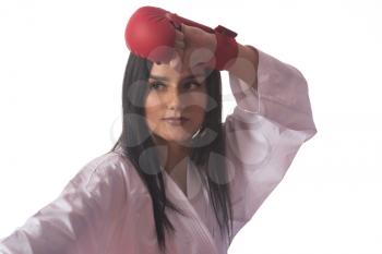 Young Muslim Woman In Traditional Kimono Practicing Her Karate Moves - Isolated On White Background