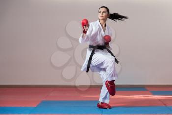 Young Woman Dressed In Traditional Kimono Practicing Her Karate Moves - Black Belt