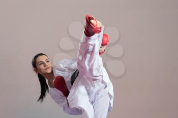 Young Woman Dressed In Traditional Kimono Practicing Her Karate Moves - Black Belt