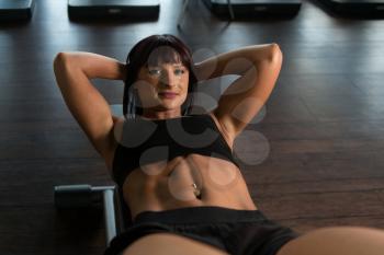 Fitness Woman Athlete Doing Abs Exercise As Part Of Bodybuilding Training