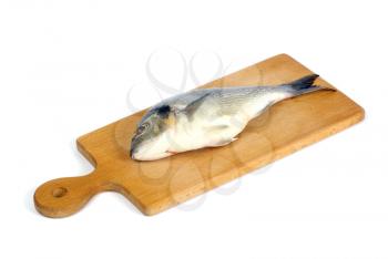 Royalty Free Photo of a Fish on a Cutting Board