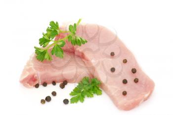 Pieces of crude meat with parsley and fennel