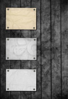 Note paper and paper clip on wooden background