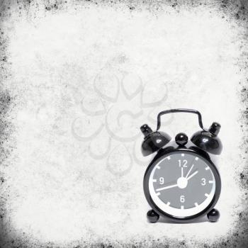 old alarm clock on old background texture