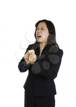 Mature Asian woman in an angry mood on white background