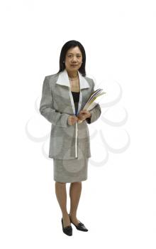 Asian woman in business formal clothing holding notepads and pen on white background