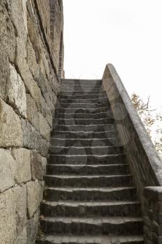 steep steps on the side of the great wall in Mutianyu China