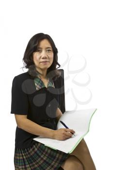 Asian women with paper and pen in business causal clothing on white background