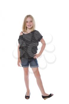 Full body front view of a pretty young girl, looking forward, isolated on white