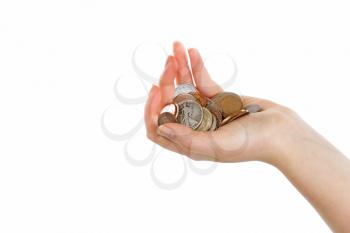 Open palm of female hand holding coins. Isolated on white background. 