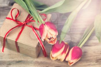 Romantic flowers and gift with light effect. 