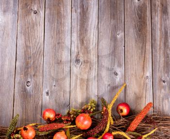 Overhead view of seasonal autumn decorations on rustic wooden boards. 