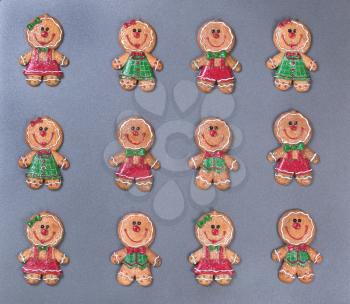 Christmas holiday gingerbread cookies on metal baking sheet pan. 