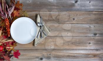 Thanksgiving holiday dinner setting on rustic wood