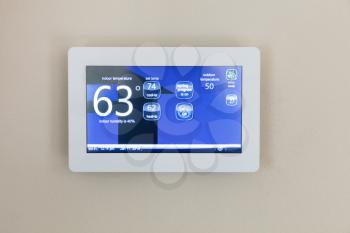 Modern technology for heating and cooling home with digital touch screen thermostat 
