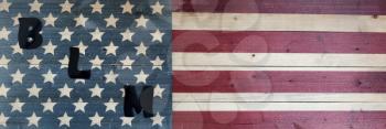 BLM capital letters on United States vintage wooden flag for black lives matter concept 