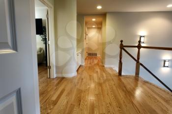 Newly installed red oak floor boards for hallway in home