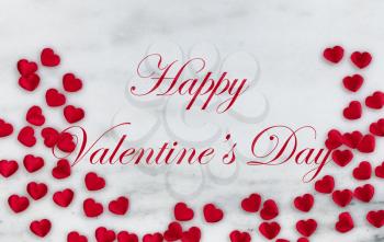 Red lovely hearts on natural marble stone in flay lay composition for Valentines Day concept with text message