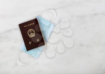Travelling during the coronavirus pandemic with Chinese passport and personal face mask